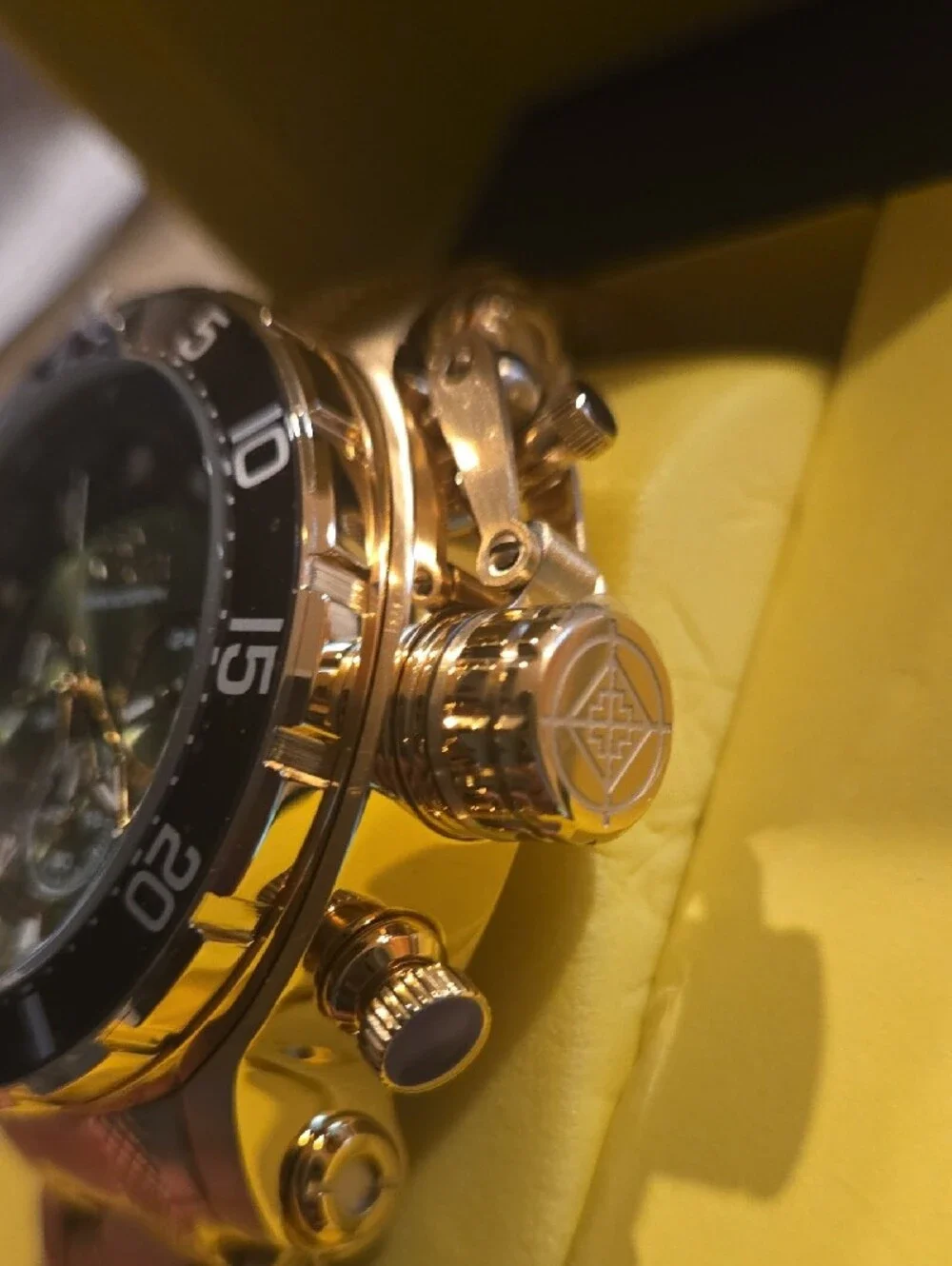 Invicta Gold and Black Chronograph Watch with Green Dial